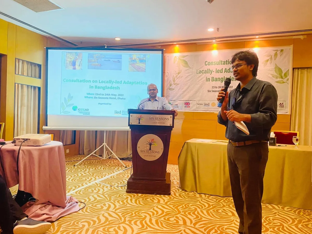 Md Bodrud-Doza speaking into a microphone during a professional consultation